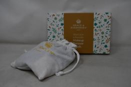 Forty boxed Grace and Evergreen washable and reusable makeup remover pads.