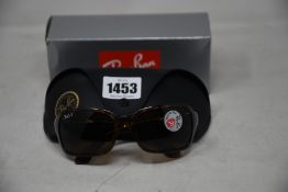 A pair of as new Ray Ban sunglasses.