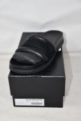 A pair of as new Alexander Wang slides in black (EU 39).