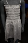 An an new Tory Burch smocked short dress in white (XS).