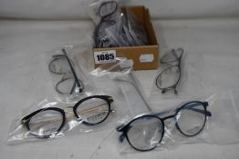 Twelve pairs of assorted as new Booth & Bruce glasses frames.