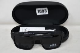 A pair of as new Hugo Boss sunglasses.