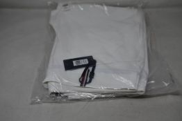 A pair of as new Tommy Hilfiger Herren equestrian breeches in optic white (S - RRP €199).