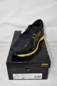 A pair of as new Asics MetaRun running trainers (UK 10.5).