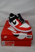 Two pairs of youths as new Nike Dunk Low (UK 4.5).