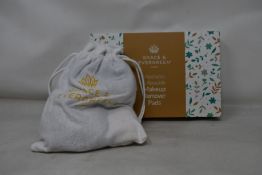 Forty boxed Grace and Evergreen washable and reusable makeup remover pads.