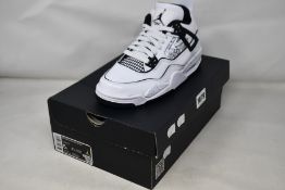 A pair of youths as new Nike Air Jordan 4 Retro (UK 4.5).