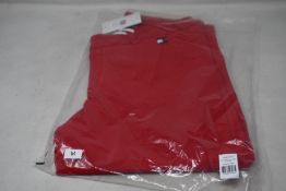 A pair of as new Tommy Hilfiger Herren equestrian breeches in primary red (M - RRP €199).