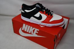 Two pairs of youths as new Nike Dunk Low (UK 6).