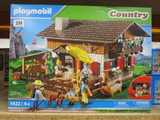 Two as new Playmobil 5552 Ferris Wheel with lights play sets and an as new 5422 Alpine Lodge play