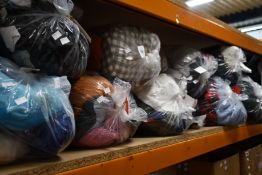 Ten bags of pre-owned clothing and related items.