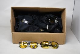 A quantity of as new AA night driving glasses (Approximately 30 pairs).