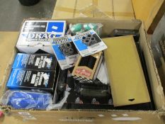 A box containing as new motorcycle parts/accessories to include a Trask Sprocket Conversion Kit 09-