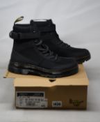 A pair of as new Dr Martens Combs Tech boots (UK 8).