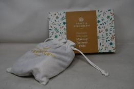 Forty boxed Grace and Evergreen washable and reusable makeup remover pads.