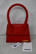An as new Jacquemus Le Chiquito Moyen bag in red.