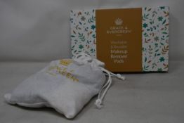 Forty boxed Grace and Evergreen washable and reusable makeup remover pads.