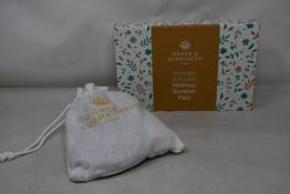 Forty boxed Grace and Evergreen washable and reusable makeup remover pads.