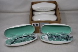 Six pairs of as new Cocoa Mint glasses frames with cases.