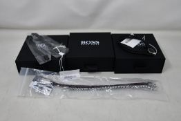 Three gents assorted as new Hugo Boss bracelets; brown leather bracelet 1580149M (RRP £69), chain