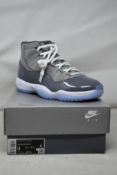A pair of as new Nike Air Jordan 11 Retro (UK 8).