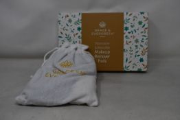 Forty boxed Grace and Evergreen washable and reusable makeup remover pads.