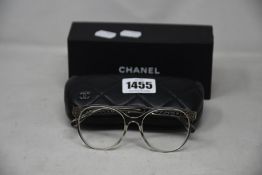 A pair of as new Chanel glasses frames.