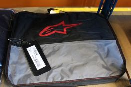 An as new Alpinestars KMX-9 V2 S Suit in Black/Red Flou (Size: EUR 150 / US 11-12).
