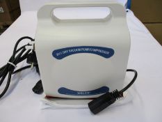 A boxed as new Welch 2511C-02 Dry Vacuum Pump/Compressor.