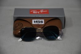 A pair of as new Ray Ban sunglasses.