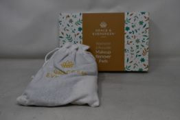 Forty boxed Grace and Evergreen washable and reusable makeup remover pads.