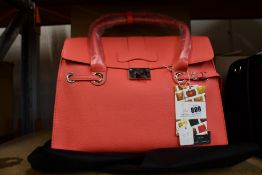 An as new Nova Harley Luxury Elegant pink leather changing bag.