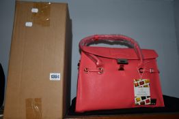 An as new Nova Harley Luxury Elegant pink leather changing bag.