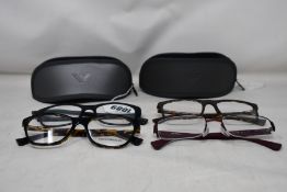 Four pairs of as new Emporio Armani glasses frames.