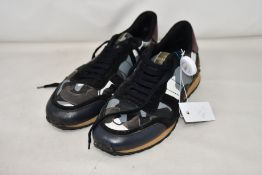 A pair of pre-owned Valentino sneakers with authentication tag (Size unknown - possible UK 7-8).
