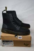 A pair of as new Dr Martens Comb 8 Eye boots (UK 12).