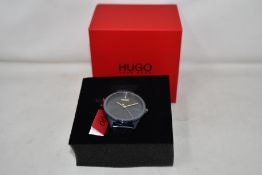 A gents as new Hugo Boss Smash wrist watch.