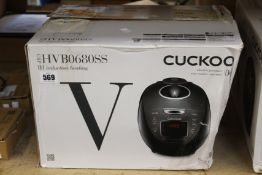 A boxed as new Cuckoo HVB0680SS rice cooker (Box damaged, requires UK power adaptor).
