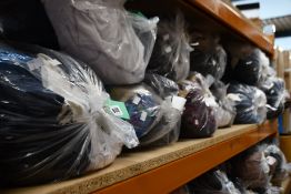 Ten bags of pre-owned clothing and related items.