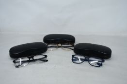 Three pairs of assorted as new Ray Ban glasses frames.