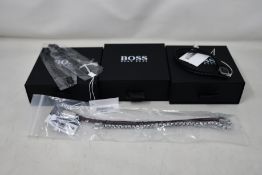 Three gents assorted as new Hugo Boss bracelets; brown leather bracelet 1580149M (RRP £69), chain