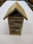 Eleven wooden hanging Bee Hives with removable trays.
