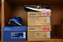 Three pairs of as new Asics trainers; men's Gel-Cumulus 22 (UK 7) and two pairs of women's Gel-