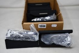 Seven pairs of as new Land Rover glasses frames with cases.