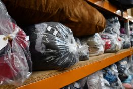 Ten bags of pre-owned clothing and related items.