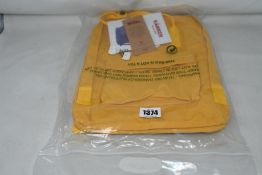 Five as new Fjall Raven Kanken backpacks in yellow.