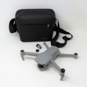 SOLD FOR PARTS: A pre-owned DJI Mavic Air 2 Drone (rear right propeller arm snapped) with battery pa