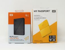 A boxed as new WD My Passport Ultra for Mac 4TB Portable External Hardrive and a boxed as new WD My