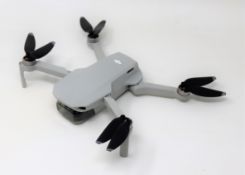A pre-owned DJI Mavic Mini Drone (Untested, sold as seen).