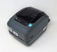 A pre-owned Zebra GX430t 300dpi Direct Thermal / Thermal Transfer Label Printer with PSU.